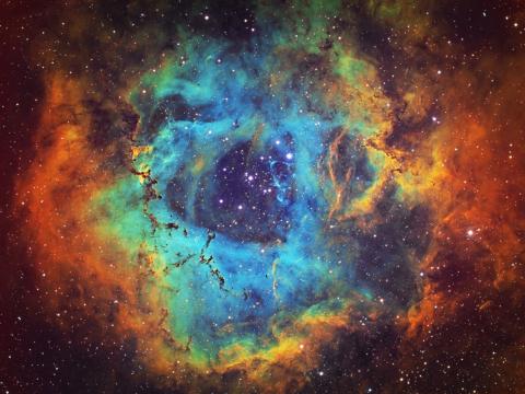 The Rosette Nebula (NGC 2237, Caldwell 49) is the large hydrogen, sulfur and oxygen gas cloud in the constellation of Monoceros. The open star cluster NGC 2244 (Caldwell 50) consists of stars being formed from the nebula. The nebula is 5,200 light years a